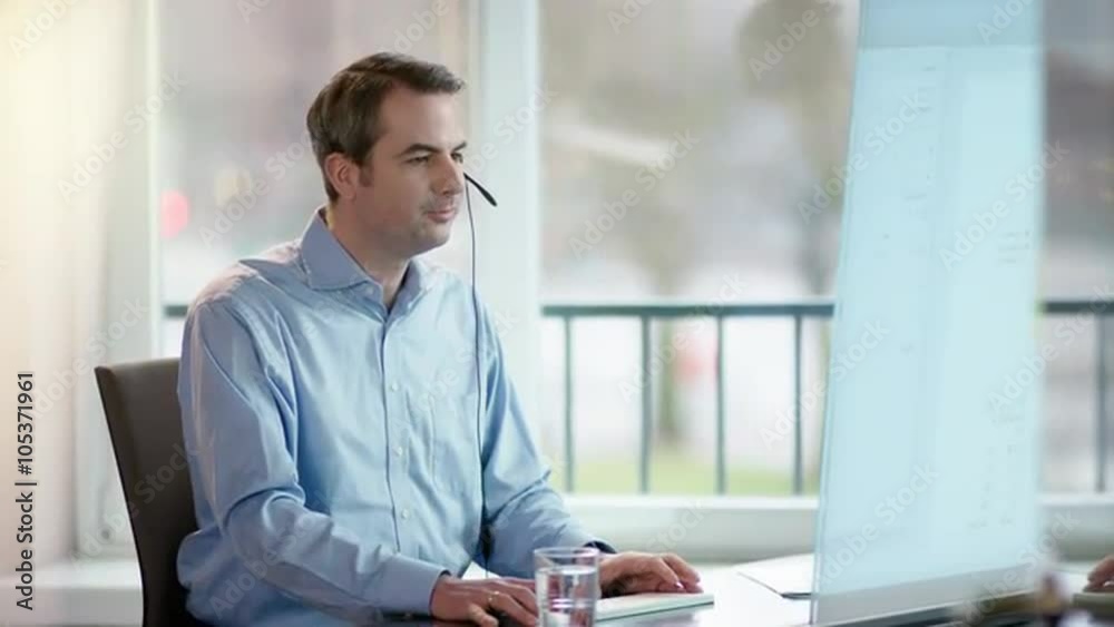 business man at office desk talking on the phone business man at office desk talking on the phone