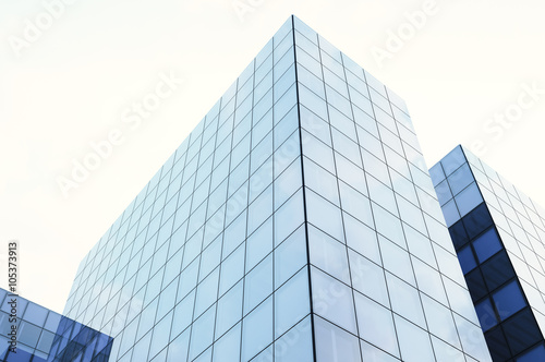 Perspective and underside angle view of modern glass blue building skyscrapers. Blue sky  horizontal mockup. 3d render