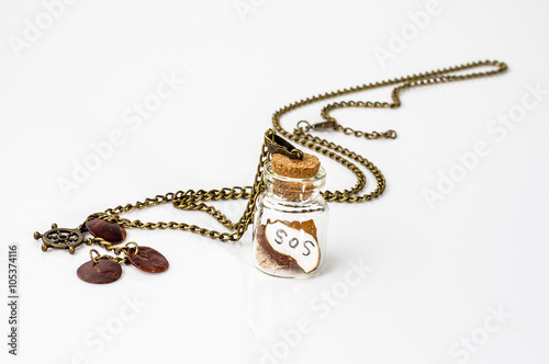 Pendant made with glass bottle, antique gold chain and amber iso