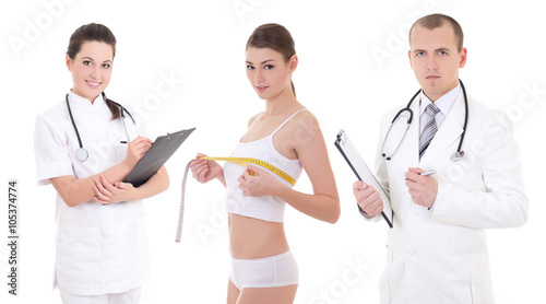 Obraz na płótnie plastic surgery and breast augmentation concept - two doctors an