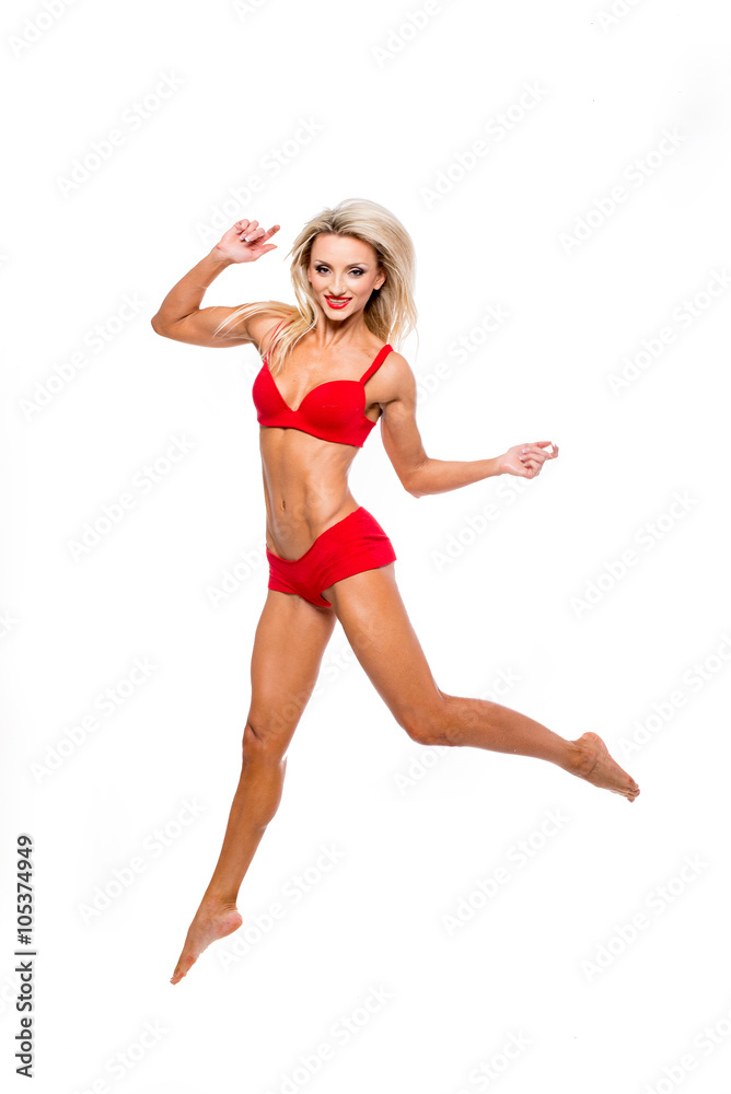 beautiful girl in a bathing suit jumped on a white background beautiful girl in a bathing suit jumped on a white background