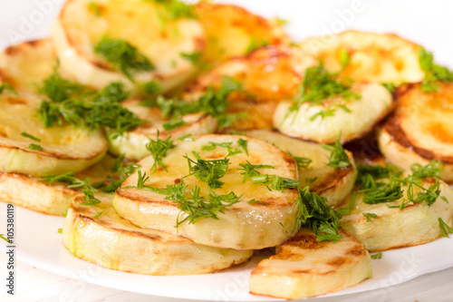 Appetizing zucchini, grilled in oil and strewed with greengrocer