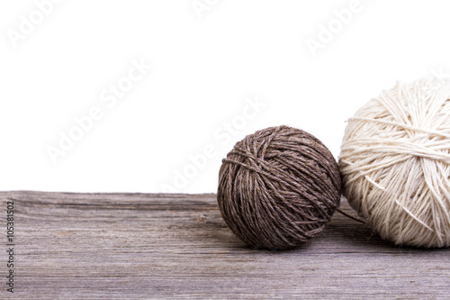 balls of wool on wooden table