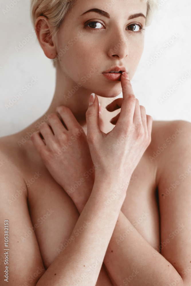 Beautiful blondie girl near white wall Beautiful blondie girl near white wall