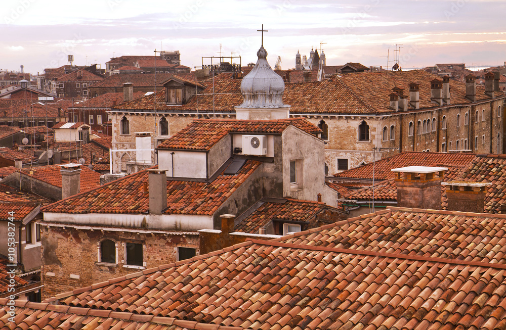 Beautiful view of antique Venice roofs at dawn