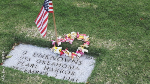 Slow panning clip in Punchbowl National Cemetery of a gravesite of 9 unknown people who died aboard the USS Oklahoma during the attack on Pearl Harbor on December 7, 1941. photo