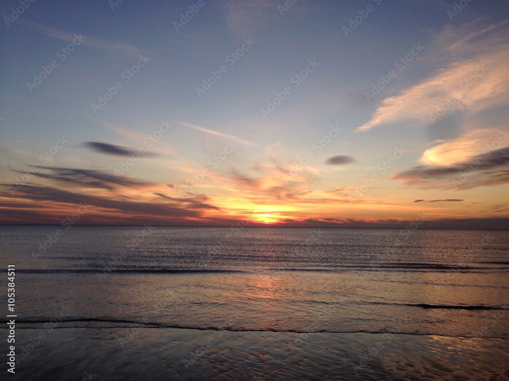 beautiful warm romantic sunset over a sandy beac