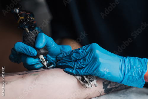 tattooing black and white, plugging sleeves, a close-up of sterile gloves