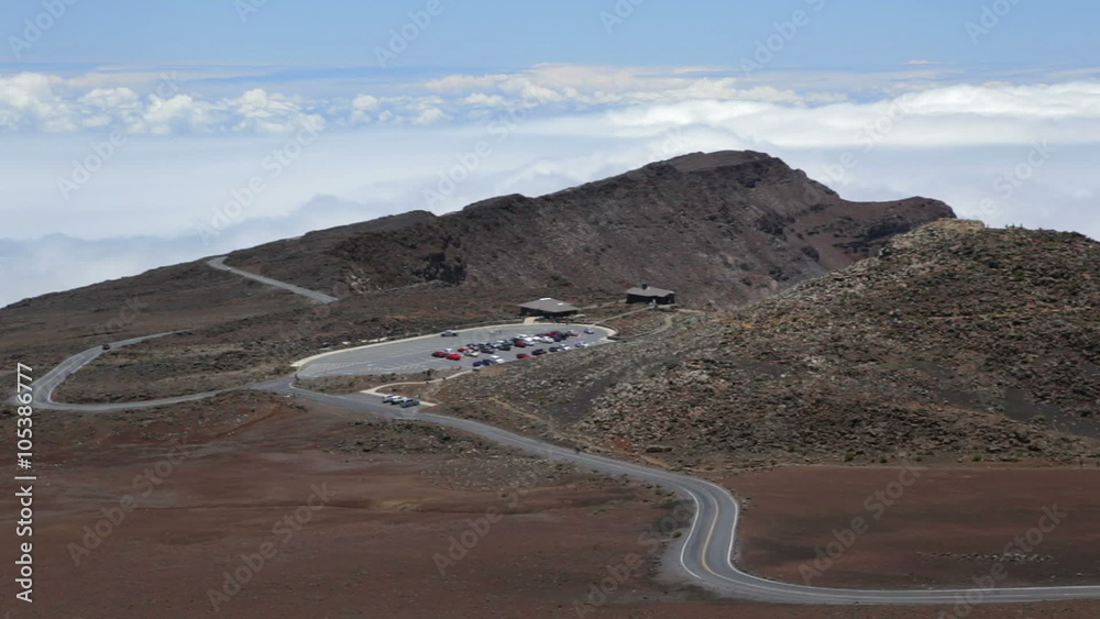 Haleakala Crater Road with the upper Visitor's Center and parking lot in the distance, panning to a view into Haleakala Crater. Haleakala Crater Road with the upper Visitor's Center and parking lot in the distance, panning to a view into Haleakala Crater.