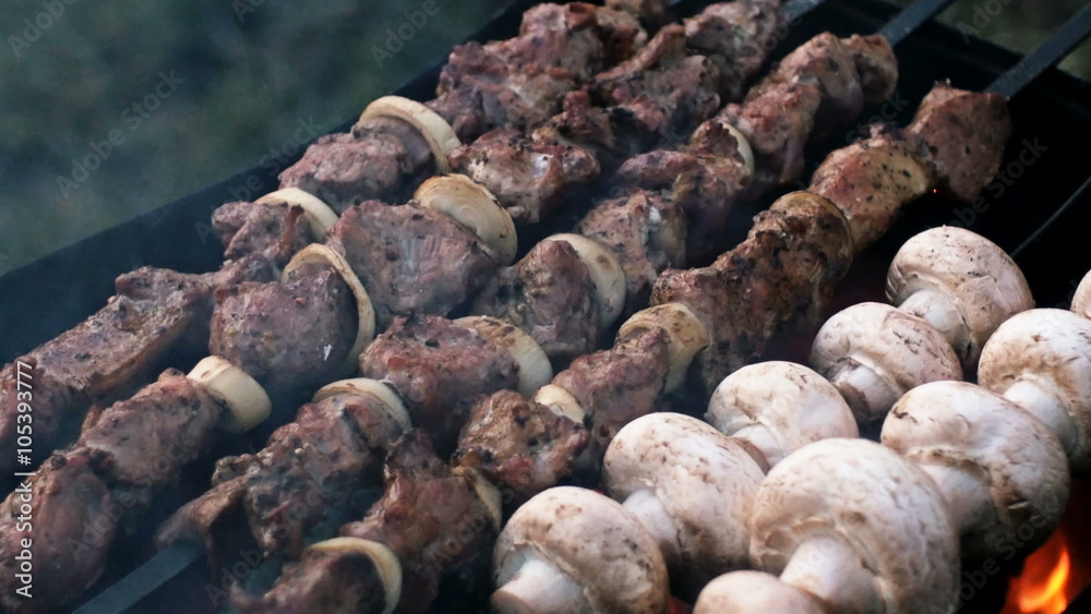 meat and mushrooms roasted on the fire skewers meat and mushrooms roasted on the fire skewers