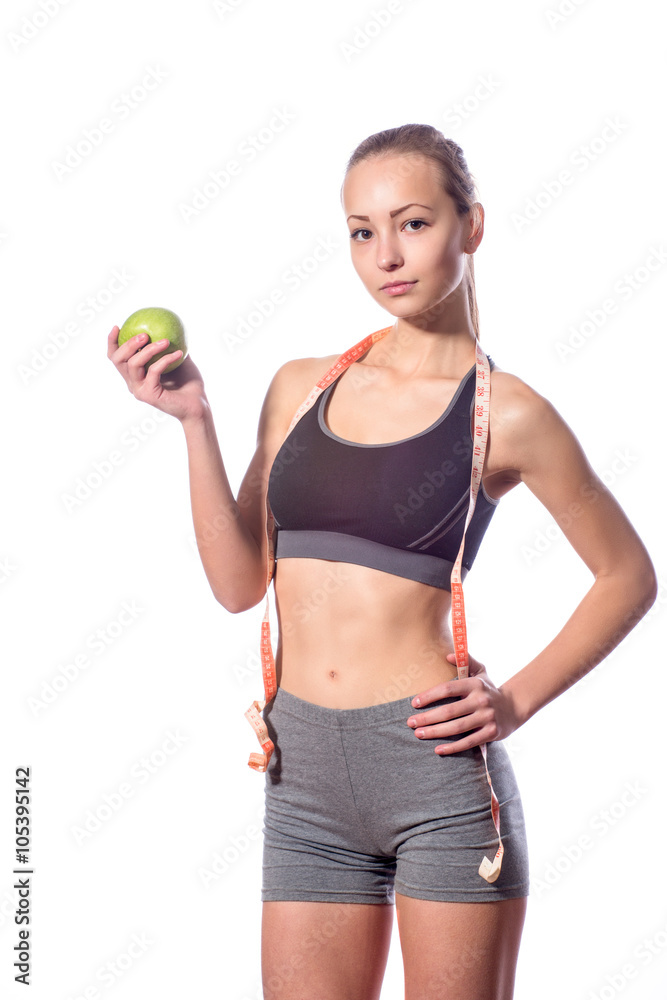 attractive fitness model with measuring tape on a white background attractive fitness model with measuring tape on a white background