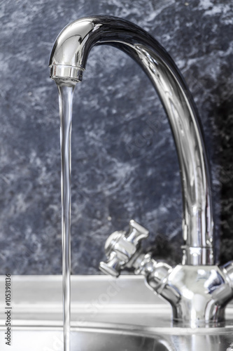 Kitchen faucet and sink close up