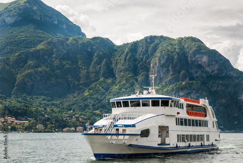 The white car and passenger ferry on Lake Como