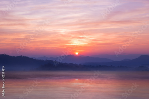 Colorful sunset on top of thailand mountain and lagoon