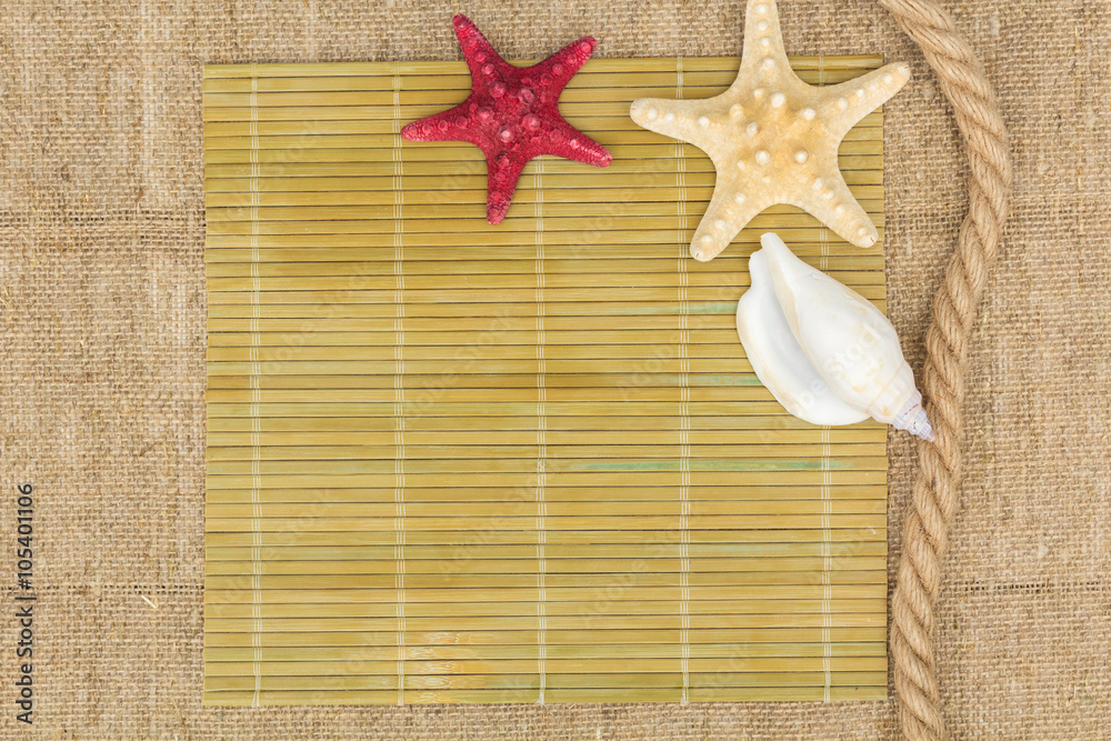 starfish and rope lying on a sackcloth starfish and rope lying on a sackcloth