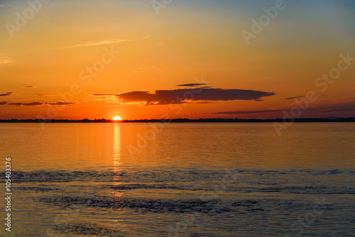 Summer sunset over the river.  Summer sunset over the Amur river.