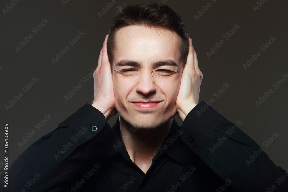 Obraz premium man covers his ears