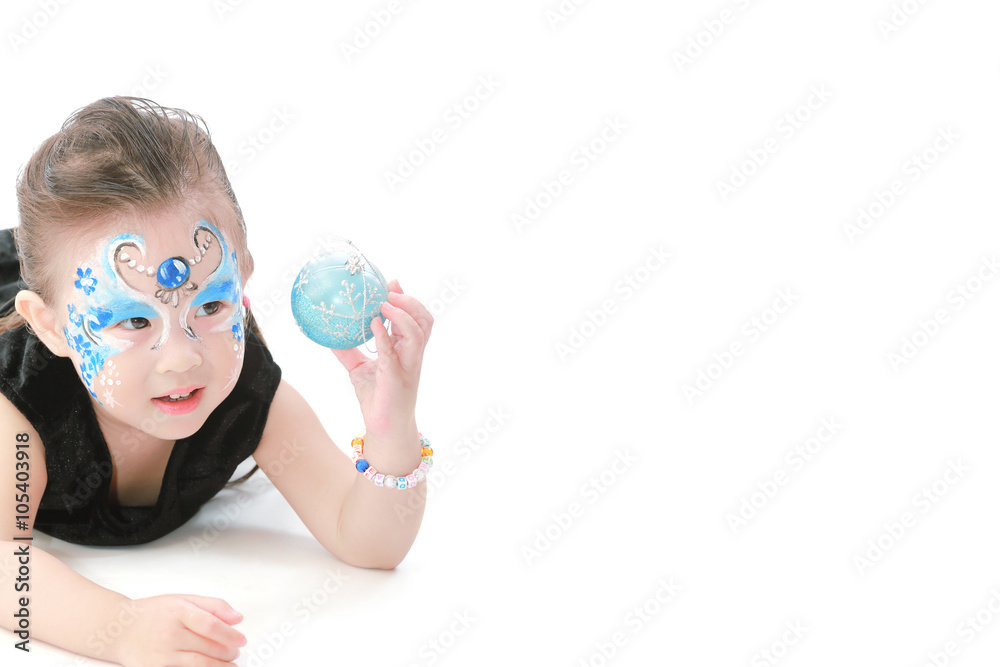 Asian little girl with painted face Asian little girl with painted face