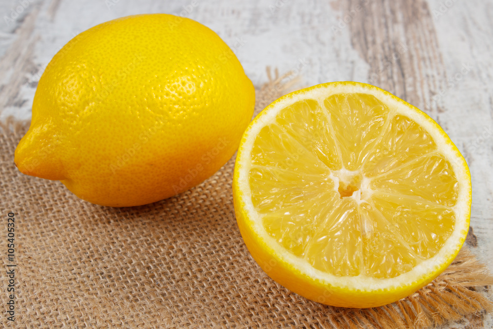 Fresh lemon on old white wooden table, healthy food and nutrition Fresh lemon on old white wooden table, healthy food and nutrition