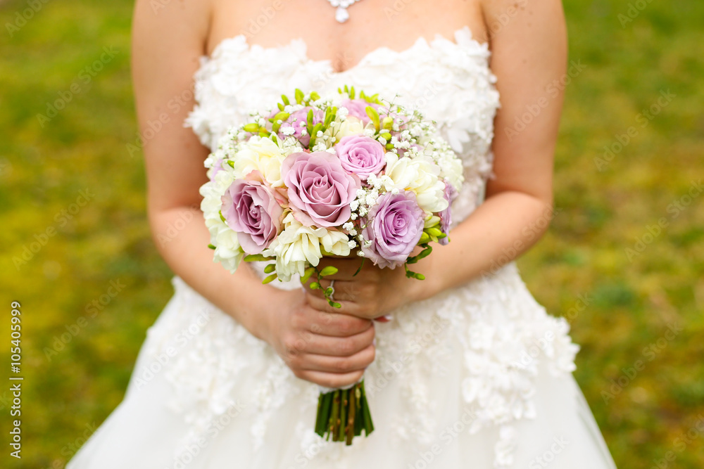 Wedding bouquet with peony, roses, orchids, and green leaves. Tenderness hand made accessory for bride Wedding bouquet with peony, roses, orchids, and green leaves. Tenderness hand made accessory for bride