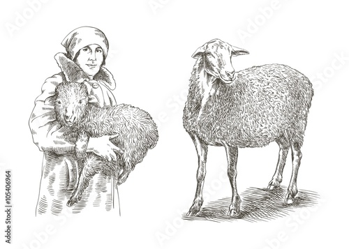 Female farmer holding a lamb in his hands