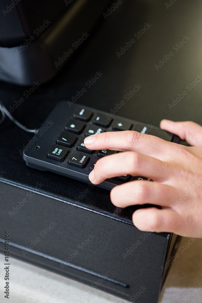 Womans hand holding calculator Womans hand holding calculator
