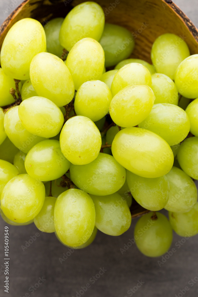 Grape cluster on the grey background.