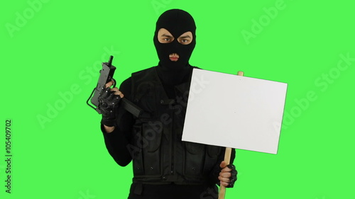 Terrorist with sign on green screen