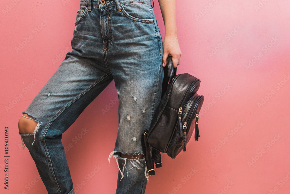 Stylish Model in a fashionable Clothes and Accessories against the background of a pink wall Stylish Model in a fashionable Clothes and Accessories against the background of a pink wall