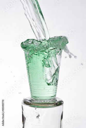 Green drink poured into a glass