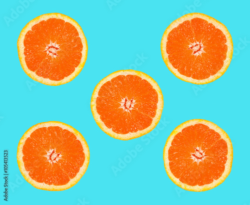 slices of grapefruit on a blue background