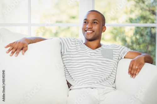 Handsome man sitting on the sofa