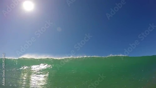 Green Water Surfing Wave Breaking At Beach Pov  photo