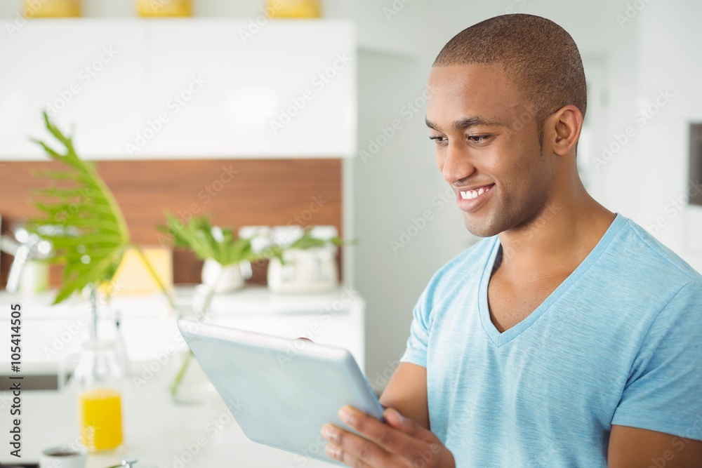 Handsome man using tablet Handsome man using tablet