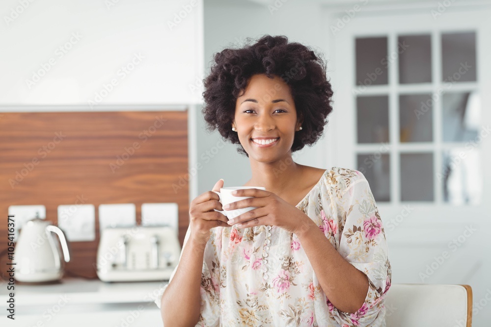 Portrait of smiling woman holding white cup Portrait of smiling woman holding white cup