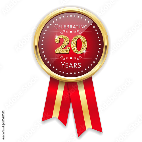 Red celebrating 20 years badge, rosette with gold border and ribbon