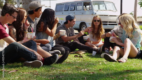 Group of young people hanging out at park