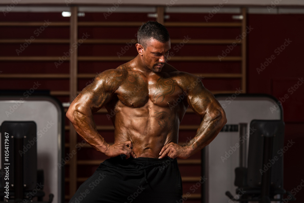 Serious BodyBuilder Standing In The Gym Serious BodyBuilder Standing In The Gym