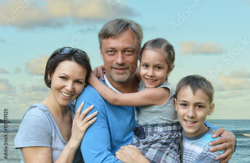 Happy family on sea beach