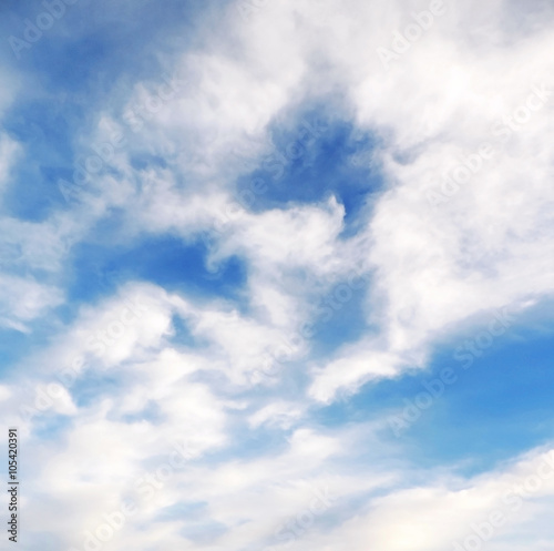 Blue sky with white cumulus clouds. Cloudscape in the sun  good weather with copy space. Nature background with clear blue sky and fluffy clouds.