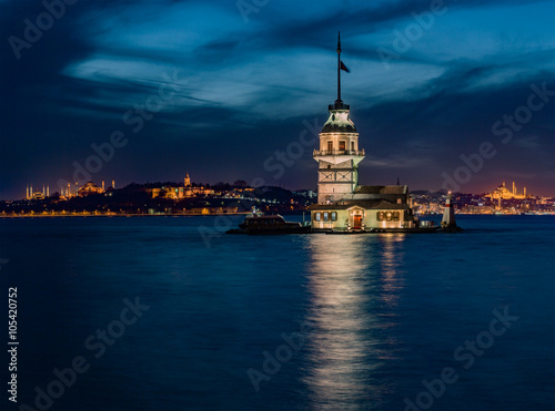 Maiden's Tower and The Old Town with Topkapi Palace and Mosques at night in Istanbul Turkey