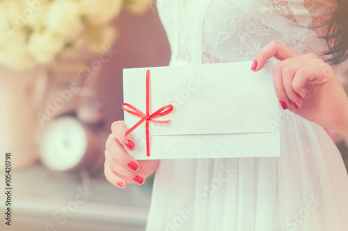 Gift card - closeup of woman showing sign card.