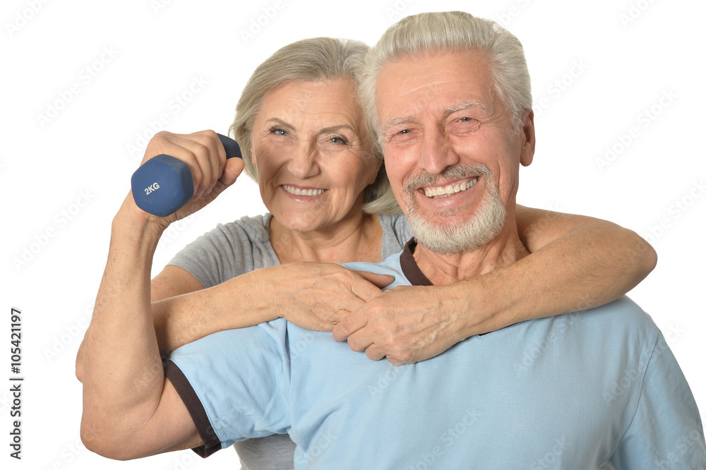 Senior Couple Standing With Dumbbells Senior Couple Standing With Dumbbells