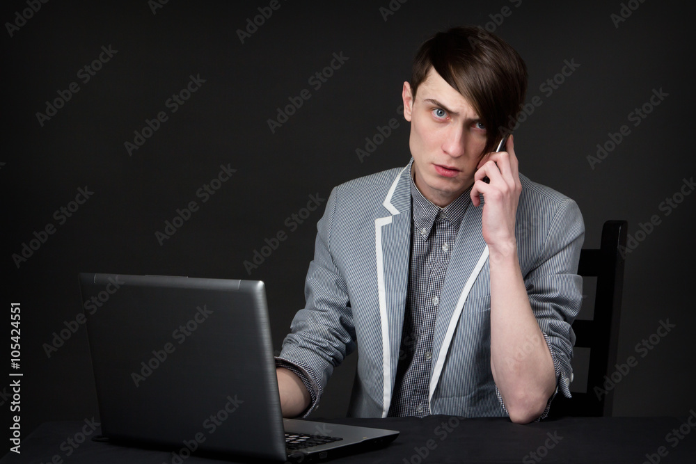 Young guy talking on the phone Young guy talking on the phone
