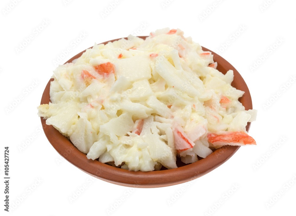 Bowl of surimi crab meat with mayonnaise isolated on a white background. Bowl of surimi crab meat with mayonnaise isolated on a white background.