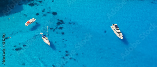 Aerial view of yachts in azure sea