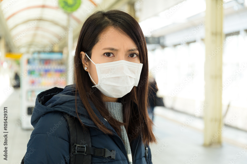 Woman wearing face mask for protection Woman wearing face mask for protection