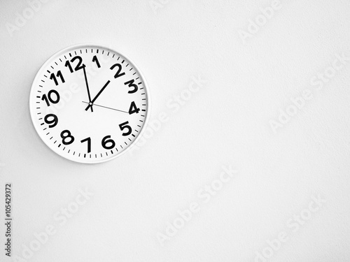 Monochrome clock on the wall for background