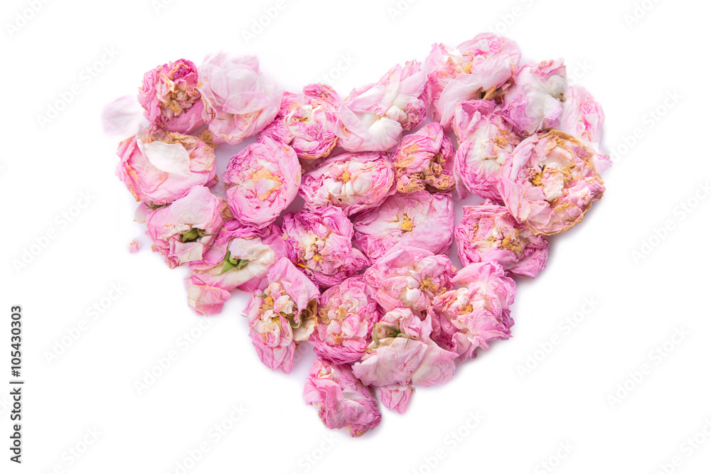 Fototapeta premium Dried rose buds forming heart