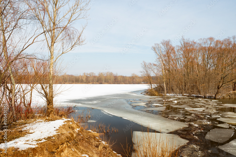 Ice fragments under thin layer of frozen river water. Ice fragments under thin layer of frozen river water.
